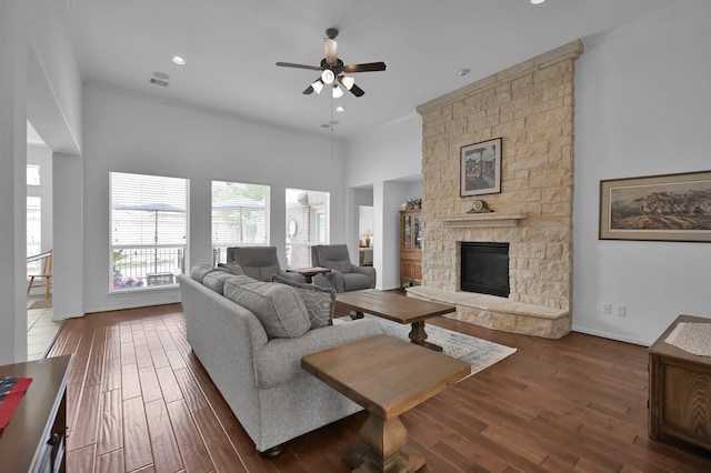 16923 Fondness Park Dr, Spring, TX 77379 - living room with ceiling fan, a stone fireplace, wood finished floors, a towering ceiling, and recessed lighting