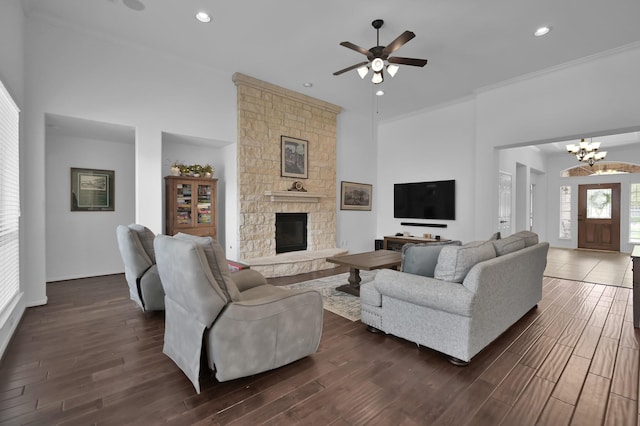 16923 Fondness Park Dr, Spring, TX 77379 - living area featuring ceiling fan, a chandelier, a stone fireplace, dark wood-style floors, and recessed lighting