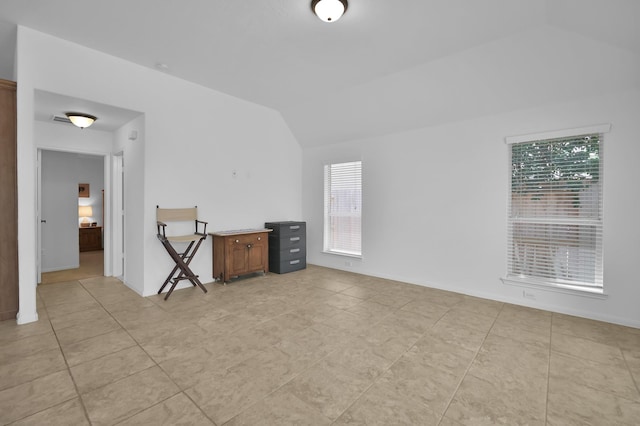16923 Fondness Park Dr, Spring, TX 77379 - unfurnished living room featuring vaulted ceiling and light tile patterned floors