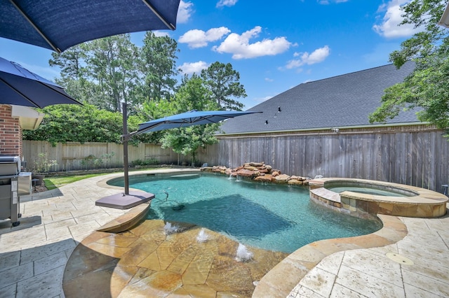 16923 Fondness Park Dr, Spring, TX 77379 - view of pool featuring a patio, a fenced backyard, and a pool with connected hot tub