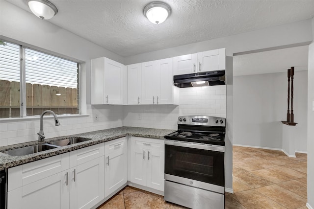 1535 Carbonear Dr, Channelview, TX 77530 - kitchen with stainless steel range with electric stovetop, under cabinet range hood, a sink, decorative backsplash, and stone countertops