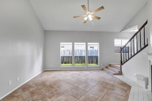 1535 Carbonear Dr, Channelview, TX 77530 - unfurnished living room with ceiling fan, stairs, high vaulted ceiling, and tile patterned flooring