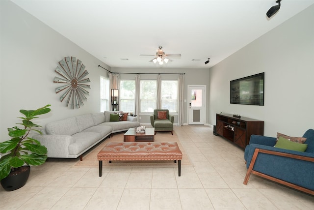 16826 Paynes Creek Dr, Cypress, TX 77433 - living area with light tile patterned flooring and ceiling fan