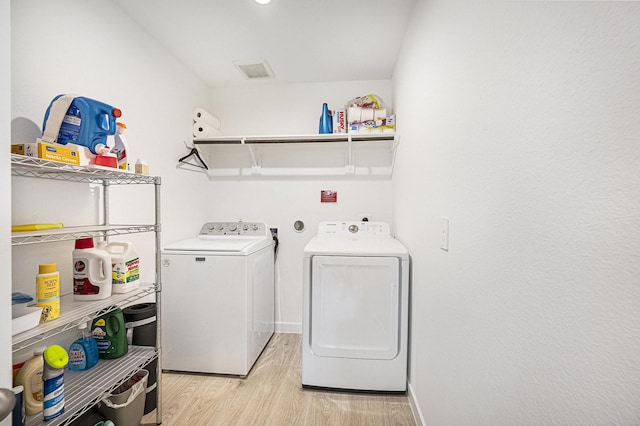 31723 Kellan Grove Ct, Fulshear, TX 77441 - laundry room featuring washer and dryer, light wood-style floors, and baseboards