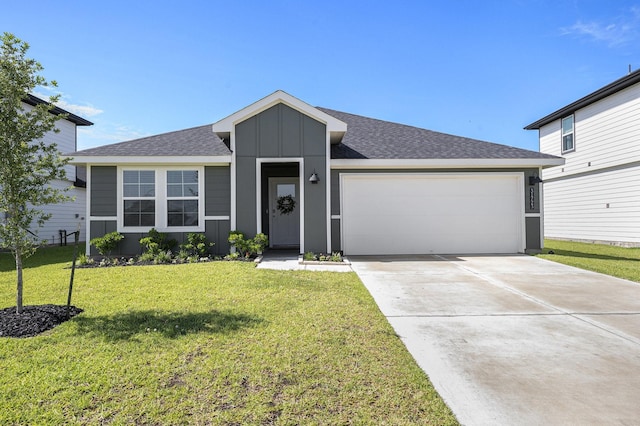31723 Kellan Grove Ct, Fulshear, TX 77441 - view of front of house featuring board and batten siding, an attached garage, a front lawn, driveway, and roof with shingles