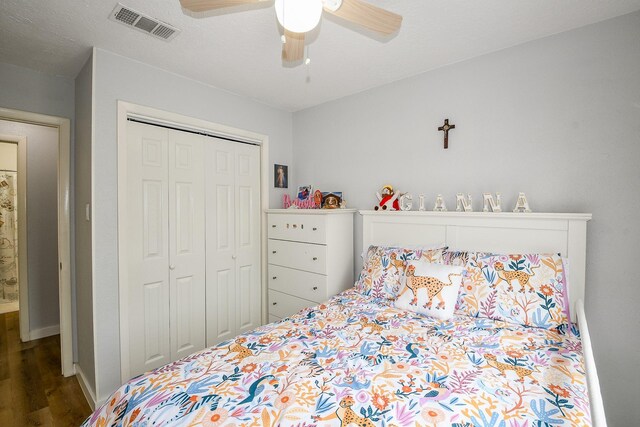 4623 Tealgate Dr, Spring, TX 77373 - bedroom featuring wood finished floors, a closet, baseboards, and a ceiling fan
