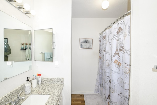4623 Tealgate Dr, Spring, TX 77373 - full bathroom featuring vanity, wood finished floors, and a shower with shower curtain