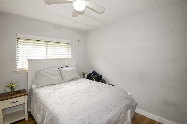 4623 Tealgate Dr, Spring, TX 77373 - bedroom with dark wood finished floors, baseboards, and ceiling fan