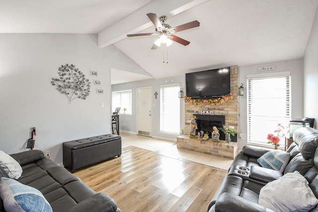 4623 Tealgate Dr, Spring, TX 77373 - living area with light wood-style floors, a ceiling fan, a brick fireplace, and baseboards