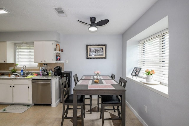 4623 Tealgate Dr, Spring, TX 77373 - dining room featuring ceiling fan, light tile patterned floors, and baseboards