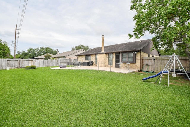 4623 Tealgate Dr, Spring, TX 77373 - rear view of property with a patio, brick siding, and a playground