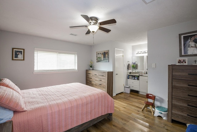 4623 Tealgate Dr, Spring, TX 77373 - bedroom featuring wood finished floors, ensuite bath, and ceiling fan