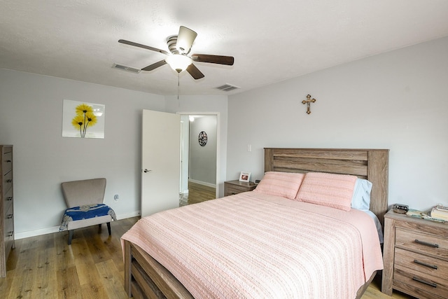 4623 Tealgate Dr, Spring, TX 77373 - bedroom with wood finished floors, baseboards, and a ceiling fan
