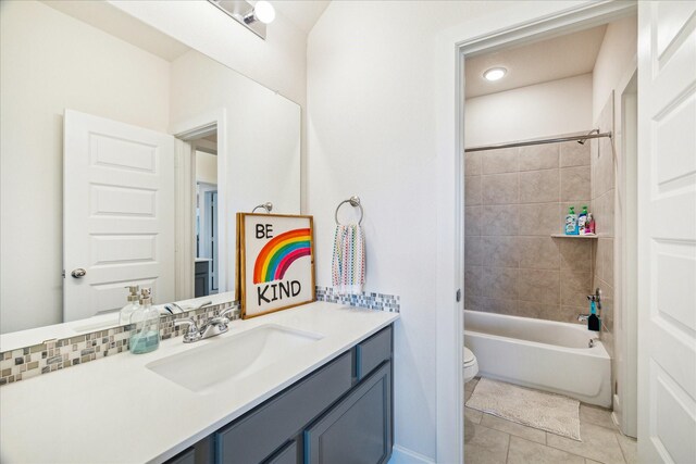 12434 Tullich Run Dr, Humble, TX 77346 - bathroom featuring toilet, vanity, tile patterned flooring, and tub / shower combination