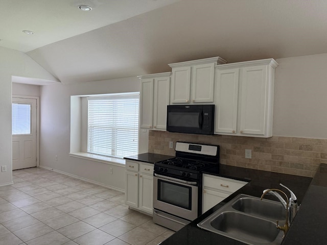 3643 Goldleaf Trail Dr, Katy, TX 77449 - kitchen with stainless steel gas range, black microwave, a sink, lofted ceiling, and light tile patterned flooring