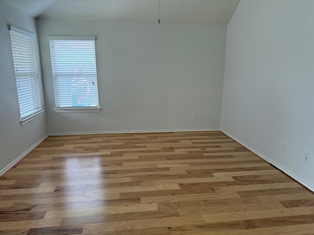 3643 Goldleaf Trail Dr, Katy, TX 77449 - spare room featuring wood finished floors, vaulted ceiling, and baseboards