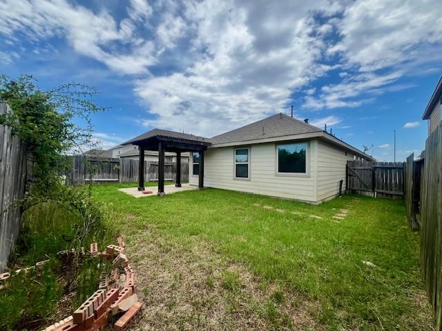3643 Goldleaf Trail Dr, Katy, TX 77449 - back of property with a patio area