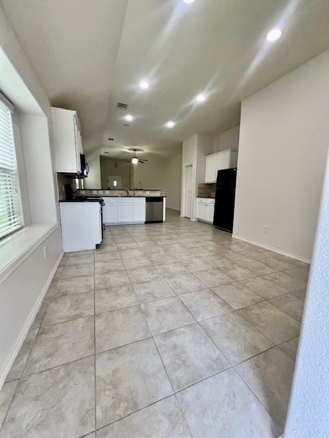 3643 Goldleaf Trail Dr, Katy, TX 77449 - kitchen with dishwasher, recessed lighting, white cabinetry, open floor plan, and a peninsula