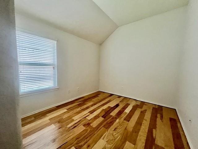 3643 Goldleaf Trail Dr, Katy, TX 77449 - unfurnished room with lofted ceiling and wood finished floors