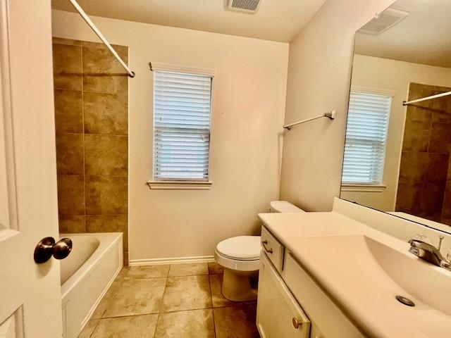 3643 Goldleaf Trail Dr, Katy, TX 77449 - bathroom with vanity, toilet, tile patterned floors, shower / bathtub combination, and healthy amount of natural light