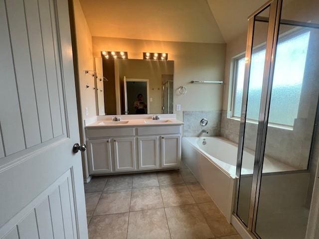 3643 Goldleaf Trail Dr, Katy, TX 77449 - bathroom with tile patterned flooring, double vanity, a bath, a shower stall, and lofted ceiling
