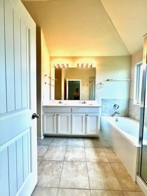 3643 Goldleaf Trail Dr, Katy, TX 77449 - bathroom with a garden tub, double vanity, tile patterned floors, and a stall shower