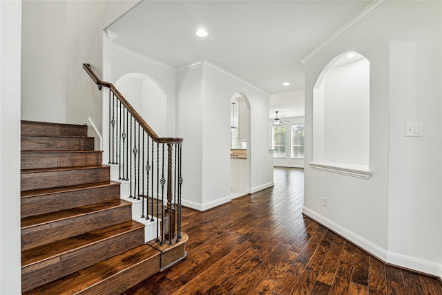 1811 Leela Springs Dr, Conroe, TX 77304 - stairs featuring arched walkways, baseboards, crown molding, wood finished floors, and ceiling fan