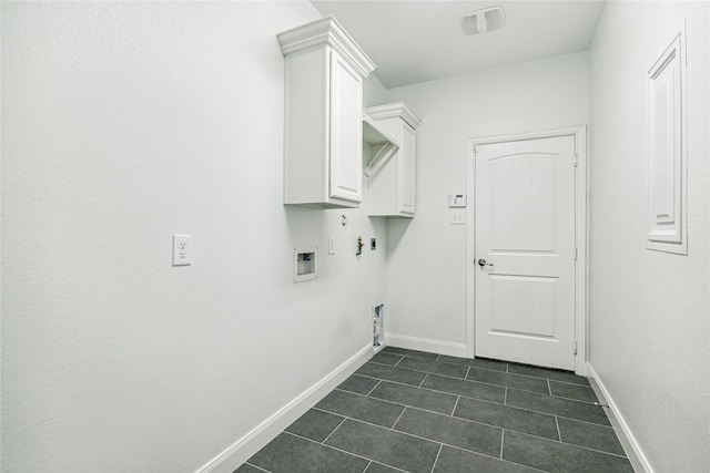 1811 Leela Springs Dr, Conroe, TX 77304 - laundry room featuring dark tile patterned flooring, baseboards, gas dryer hookup, washer hookup, and hookup for an electric dryer