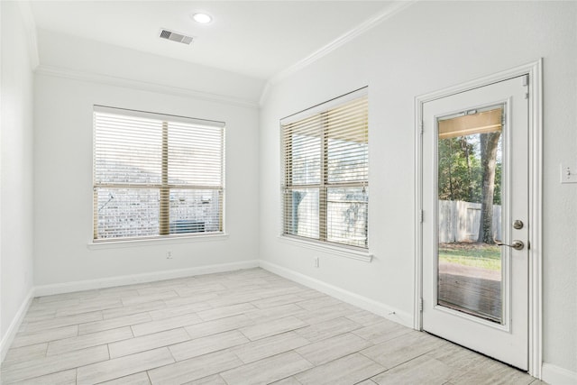 1811 Leela Springs Dr, Conroe, TX 77304 - unfurnished room with ornamental molding, baseboards, and light wood-style floors