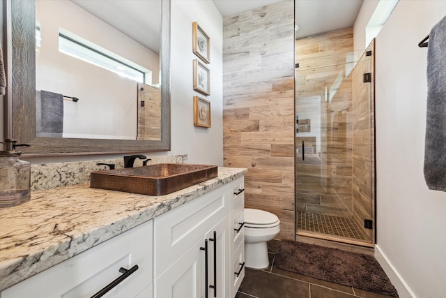 5121 Elysian St, Houston, TX 77009 - full bath featuring toilet, vanity, a stall shower, and tile patterned floors