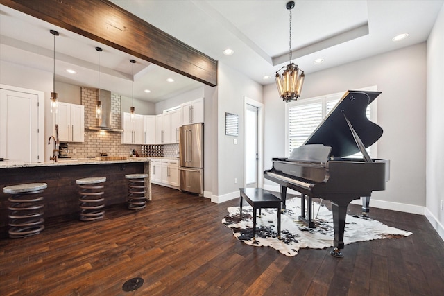 5121 Elysian St, Houston, TX 77009 - sitting room with baseboards, dark wood-style floors, recessed lighting, and a chandelier