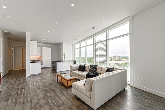 4521 San Felipe St Unit 1203, Houston, TX 77027 - living area with dark wood-style flooring, a wall of windows, and recessed lighting