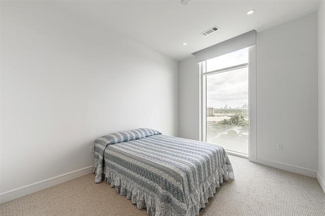 4521 San Felipe St Unit 1203, Houston, TX 77027 - bedroom with light carpet, baseboards, and recessed lighting