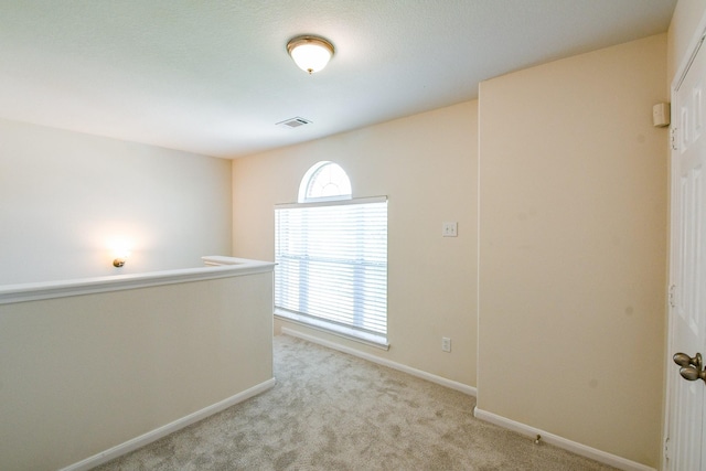 15027 Silhouette Ridge Dr, Humble, TX 77396 - spare room with light colored carpet and baseboards