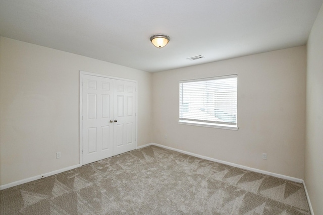 15027 Silhouette Ridge Dr, Humble, TX 77396 - unfurnished bedroom featuring carpet floors and a closet