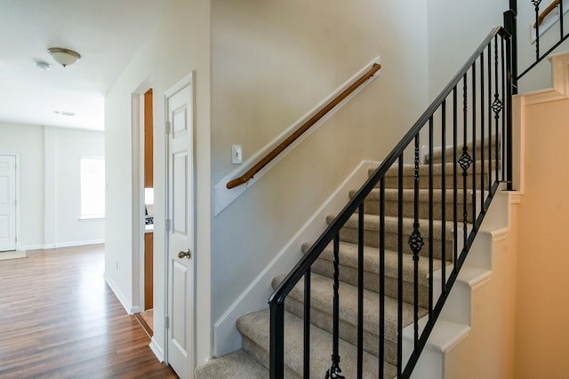 15027 Silhouette Ridge Dr, Humble, TX 77396 - stairway featuring wood finished floors and baseboards