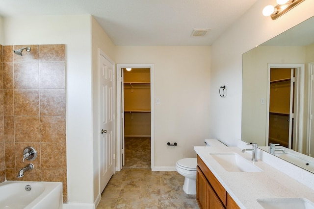 15027 Silhouette Ridge Dr, Humble, TX 77396 - bathroom with double vanity, tub / shower combination, and a spacious closet