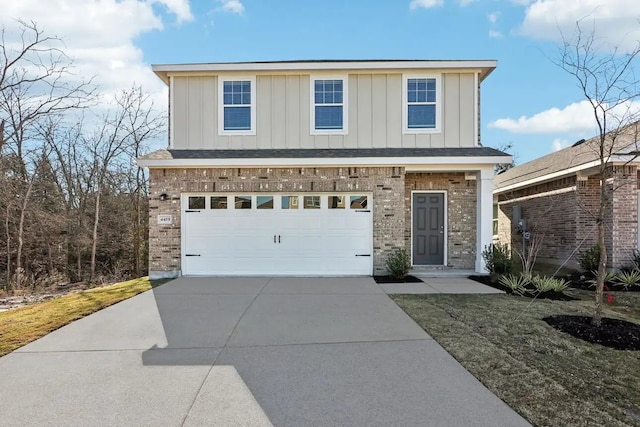 10238 Red Orchid Dr, Houston, TX 77016 - view of front facade with brick siding, board and batten siding, concrete driveway, and a garage