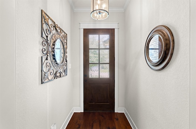 2532 Hailes Ln, College Station, TX 77845 - doorway featuring baseboards, crown molding, dark wood-type flooring, and a chandelier
