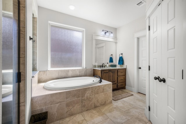 2532 Hailes Ln, College Station, TX 77845 - full bathroom featuring vanity and a bath
