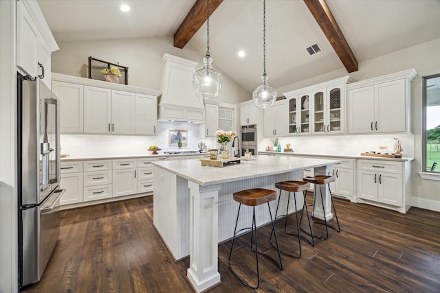21319 Rosehill Church Rd, Tomball, TX 77377 - kitchen featuring stainless steel appliances, white cabinetry, a kitchen island, dark wood-style flooring, and beam ceiling