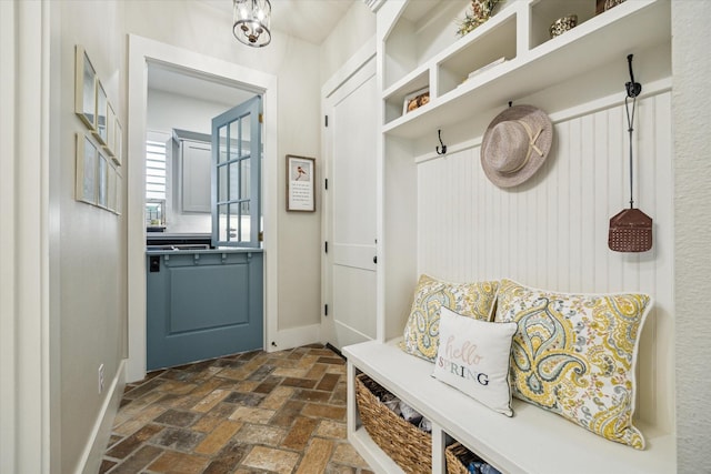 21319 Rosehill Church Rd, Tomball, TX 77377 - mudroom with brick flooring and baseboards