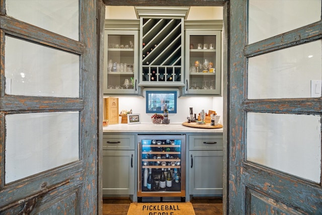 21319 Rosehill Church Rd, Tomball, TX 77377 - indoor dry bar featuring beverage cooler and wood finished floors