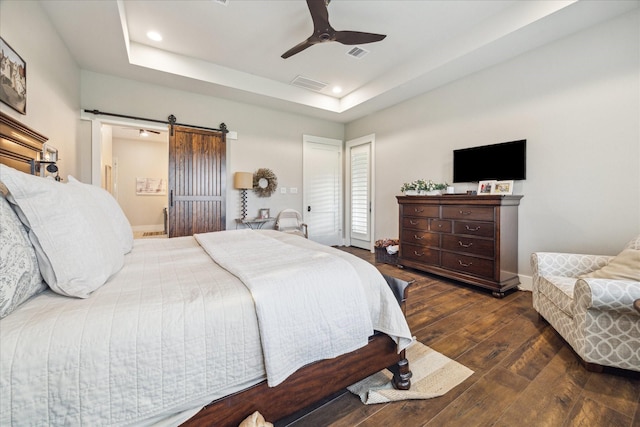 21319 Rosehill Church Rd, Tomball, TX 77377 - bedroom with hardwood / wood-style floors, a barn door, recessed lighting, a raised ceiling, and a ceiling fan
