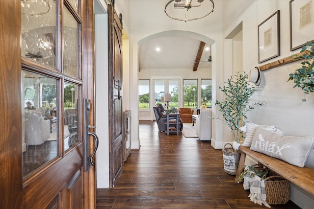21319 Rosehill Church Rd, Tomball, TX 77377 - foyer entrance featuring arched walkways, dark wood-type flooring, beam ceiling, baseboards, and a ceiling fan