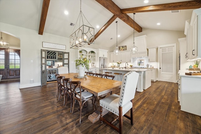 21319 Rosehill Church Rd, Tomball, TX 77377 - dining area with beamed ceiling, arched walkways, high vaulted ceiling, dark wood-style floors, and recessed lighting