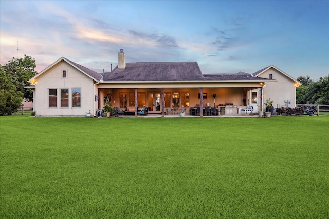 21319 Rosehill Church Rd, Tomball, TX 77377 - back of house with a lawn, a patio area, a chimney, and stucco siding