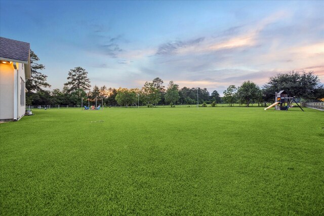 21319 Rosehill Church Rd, Tomball, TX 77377 - yard at dusk featuring a playground