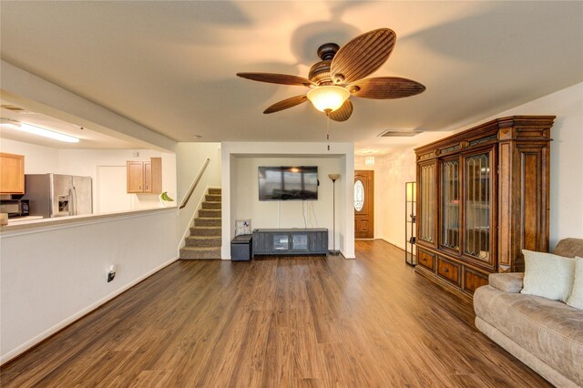 2910 Yearling Colt Ct, Houston, TX 77038 - living area with dark wood-style floors, stairway, ceiling fan, and baseboards