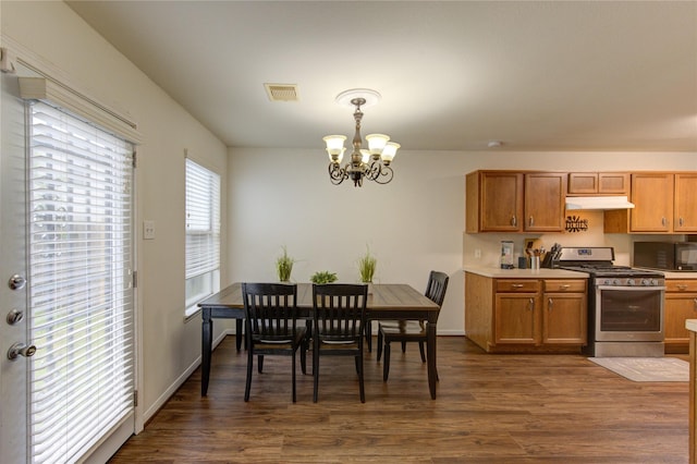 2910 Yearling Colt Ct, Houston, TX 77038 - dining room with a chandelier and dark wood-type flooring